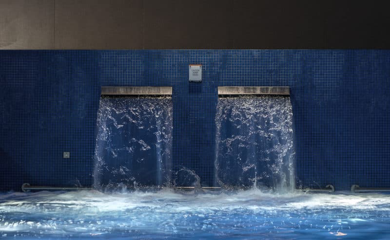 Waterfall feature with blue mosaic tiles