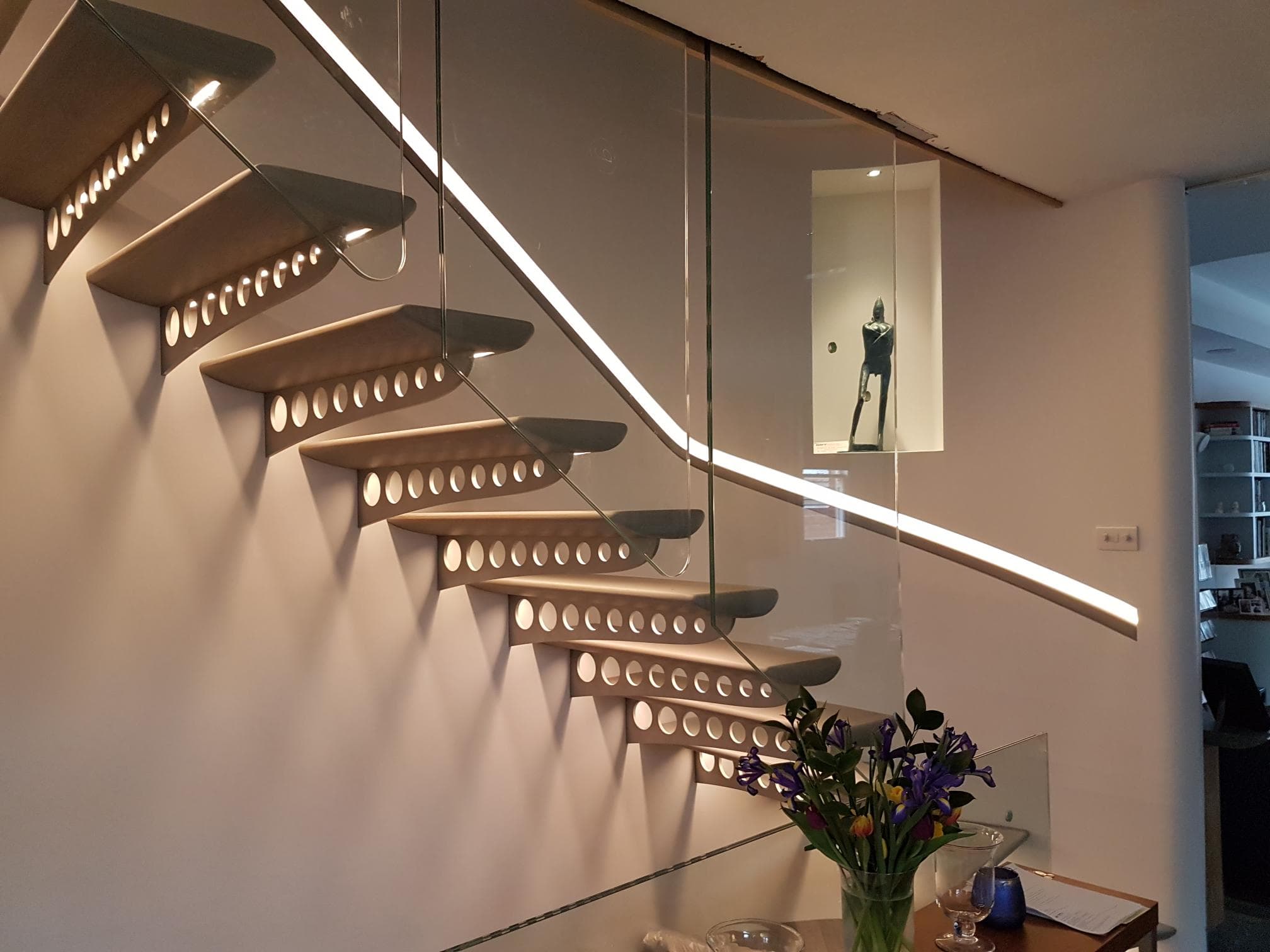 Staircase LED handrail and step lighting, side angle